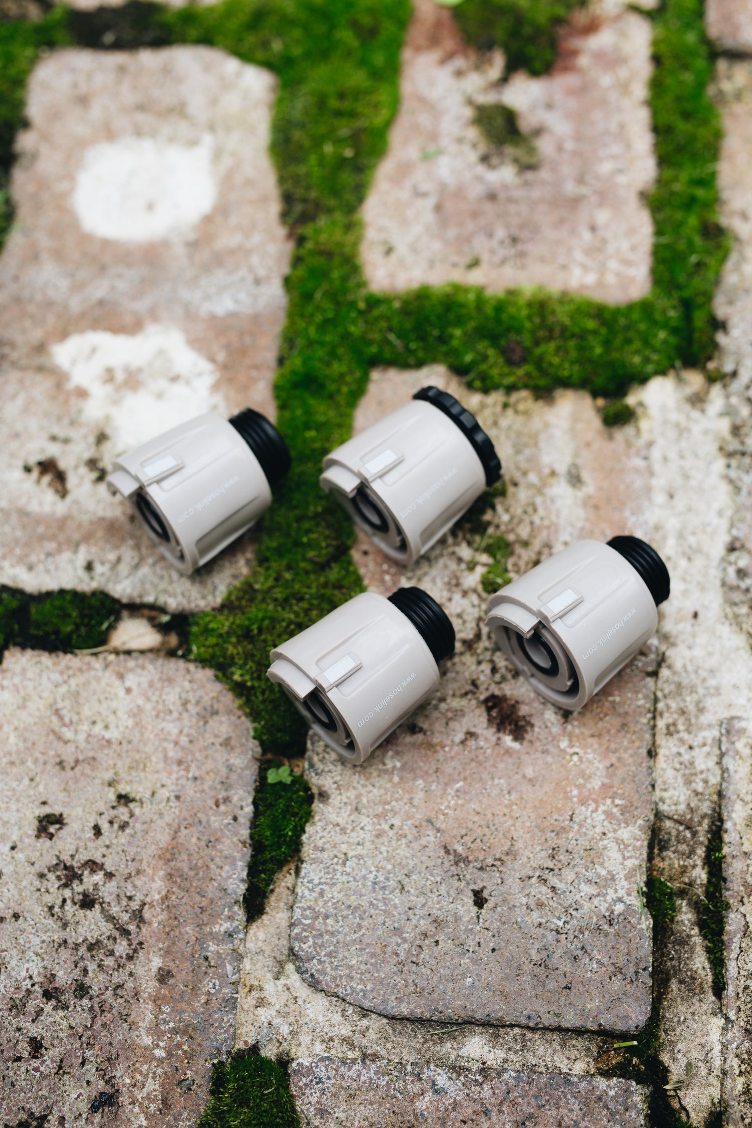 hoselink-quick-connectors-sitting-on-a-brick