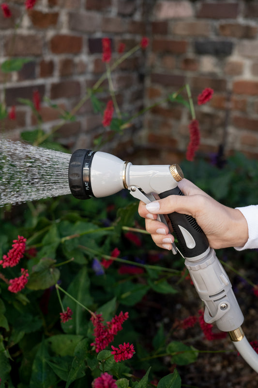 7-function-sprayer-being-used-to-water-garden