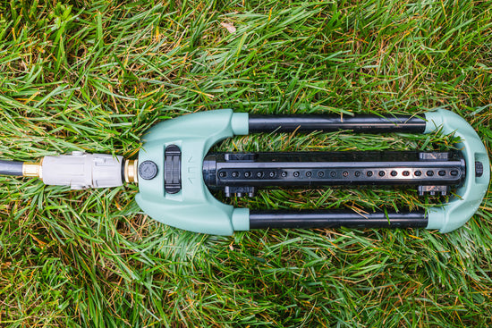 oscillating-sprinkler-lying-flat-on-grass