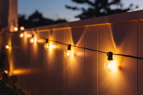 solar-festoon-lights-lighting-up-fence