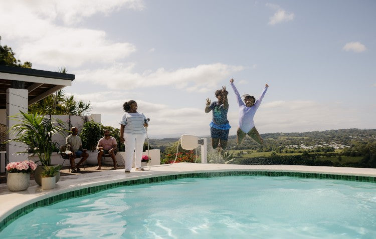 children jumping into the pool