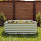 6 in 1 Garden Bed in front of a brown fence behind. Garden bed is full of plants and earth.