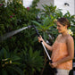 woman watering garden with 4-pattern extendable wand
