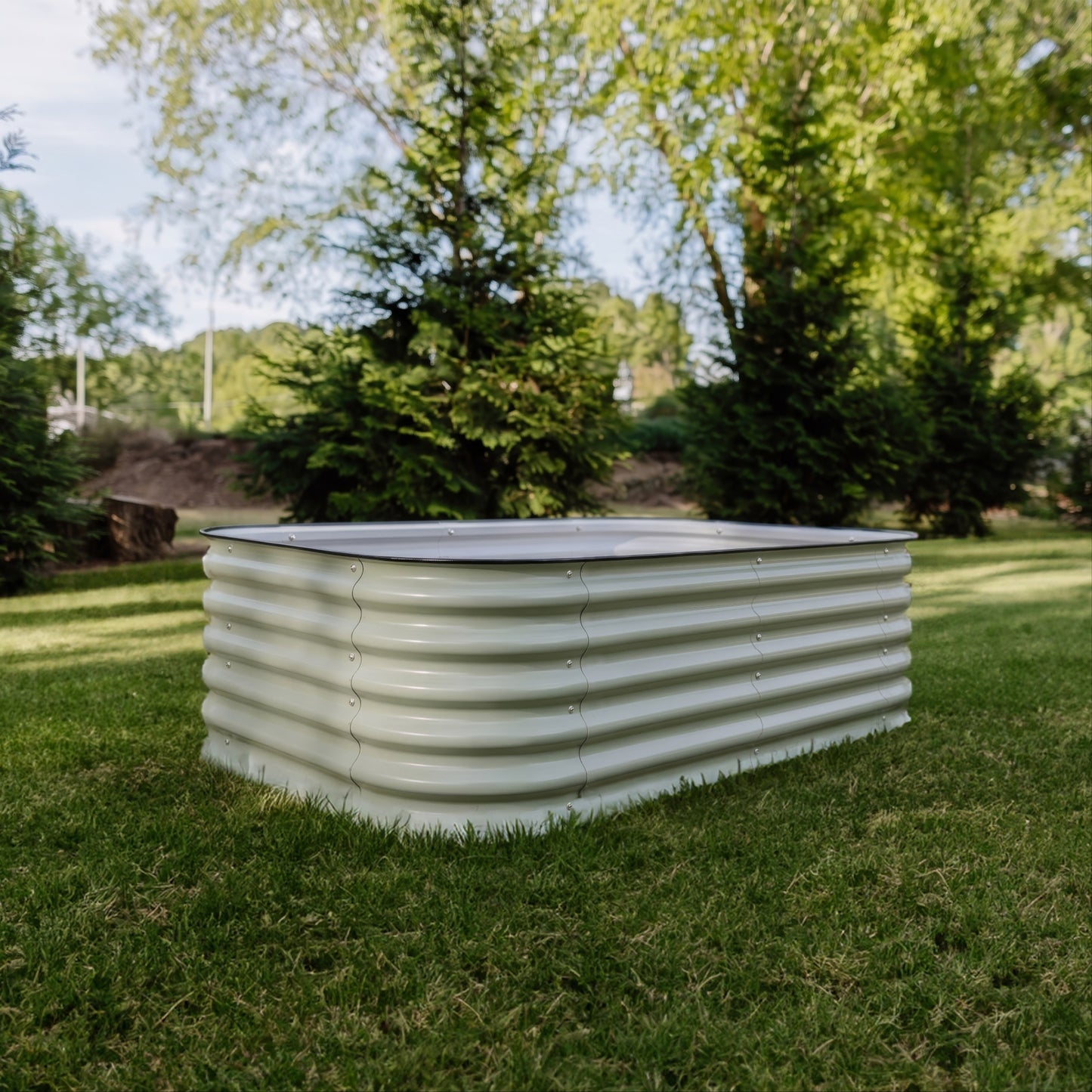 6 in 1 Garden Bed sitting on grass with three trees in the back ground.