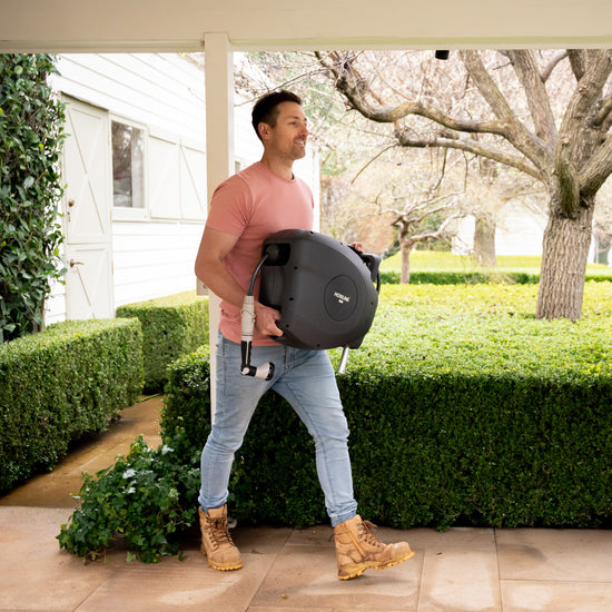 man-carrying-retractable-hose-reel