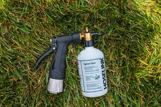 hoselink-fertilizer-spray-bottle-lying-on-its-side-on-grass