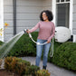 female watering her garden