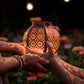 2 hands holding moroccan solar lantern