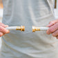Male holding end of the leader hose and the end of a garden hose close together as if about to connect