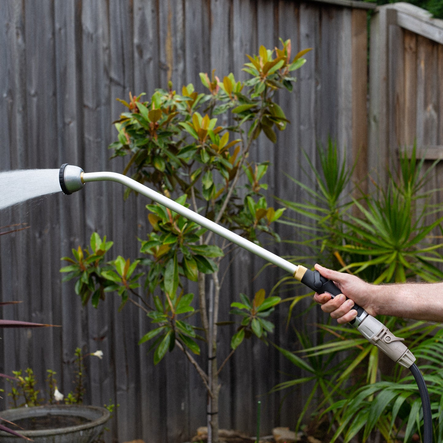 close up of the long reach shower wand