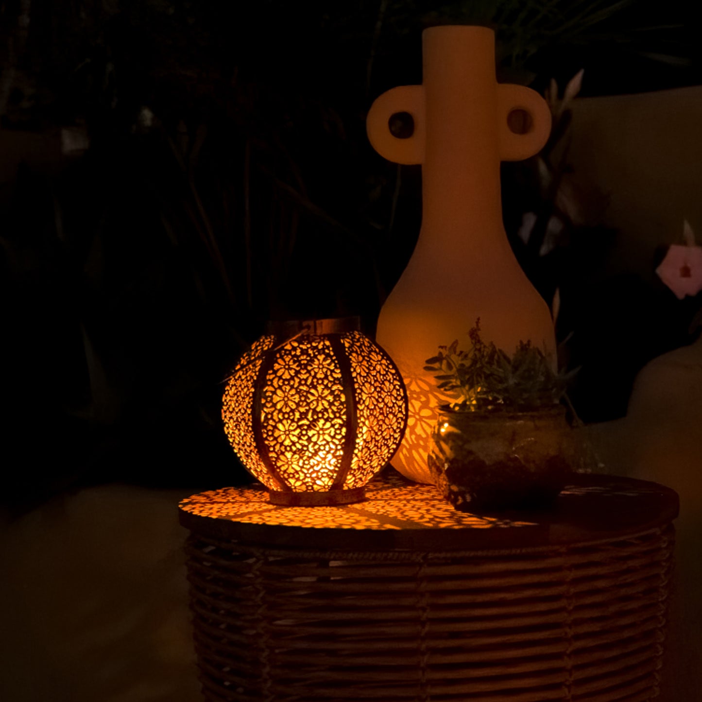 moroccan solar lantern on table with vases