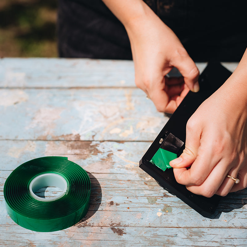 protective film being peeled off double sided tape..