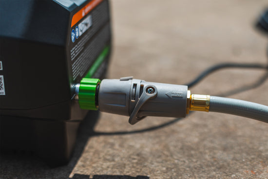black-pressure-washer-with-Hoselink-connector-attached-and-flow-control-connected-to-hose-end