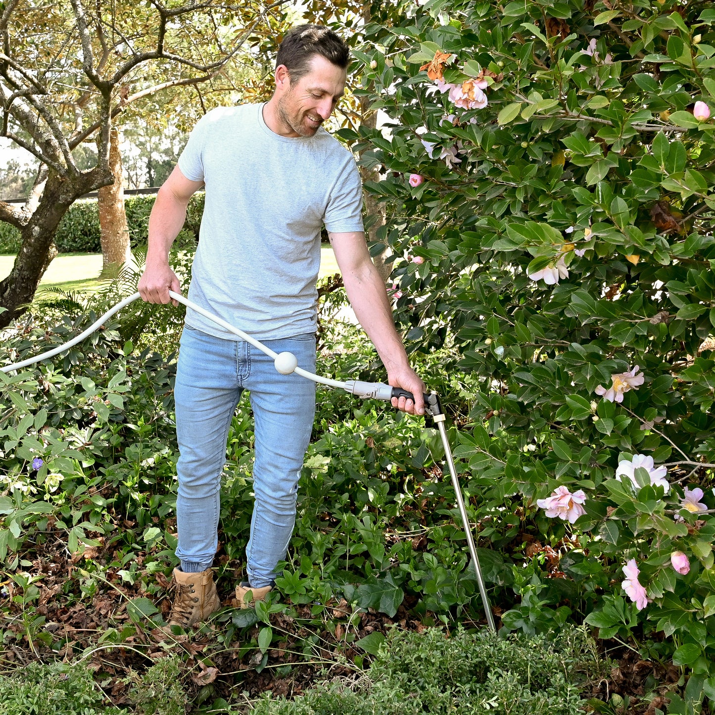 male smiling breaking the soil outdoors