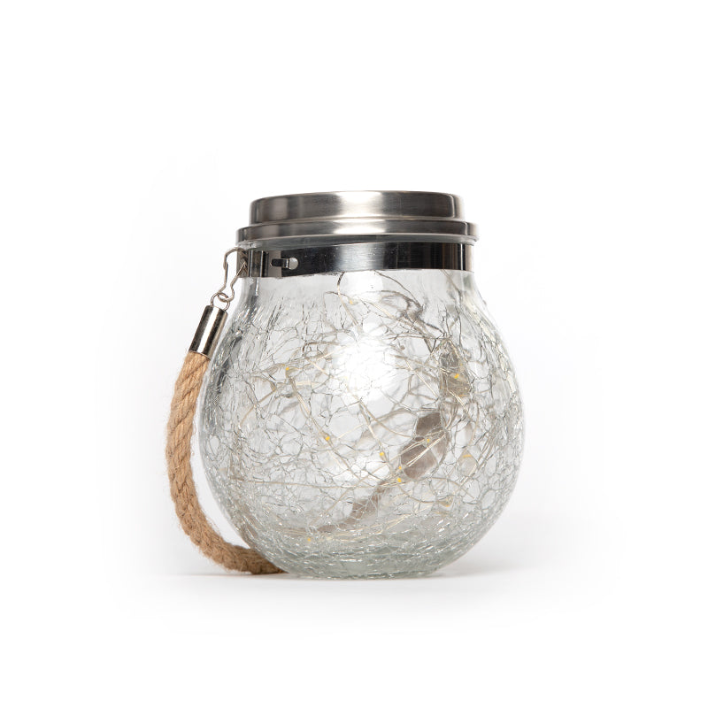 Solar crackle jar lantern sitting on a white background