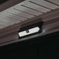 wide angle solar floodlight turned on and mounted on top of outside door frame