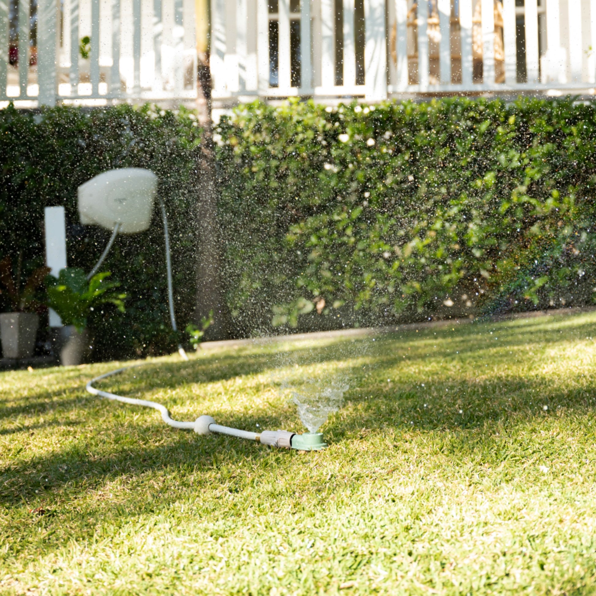 classic sprinkler attached to hose reel