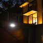 Wide angle solar floodlight on top of garage door and turned on