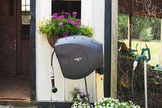 charcoal-hoselink-retractable-hose-reel-attached-to-well-water-faucet