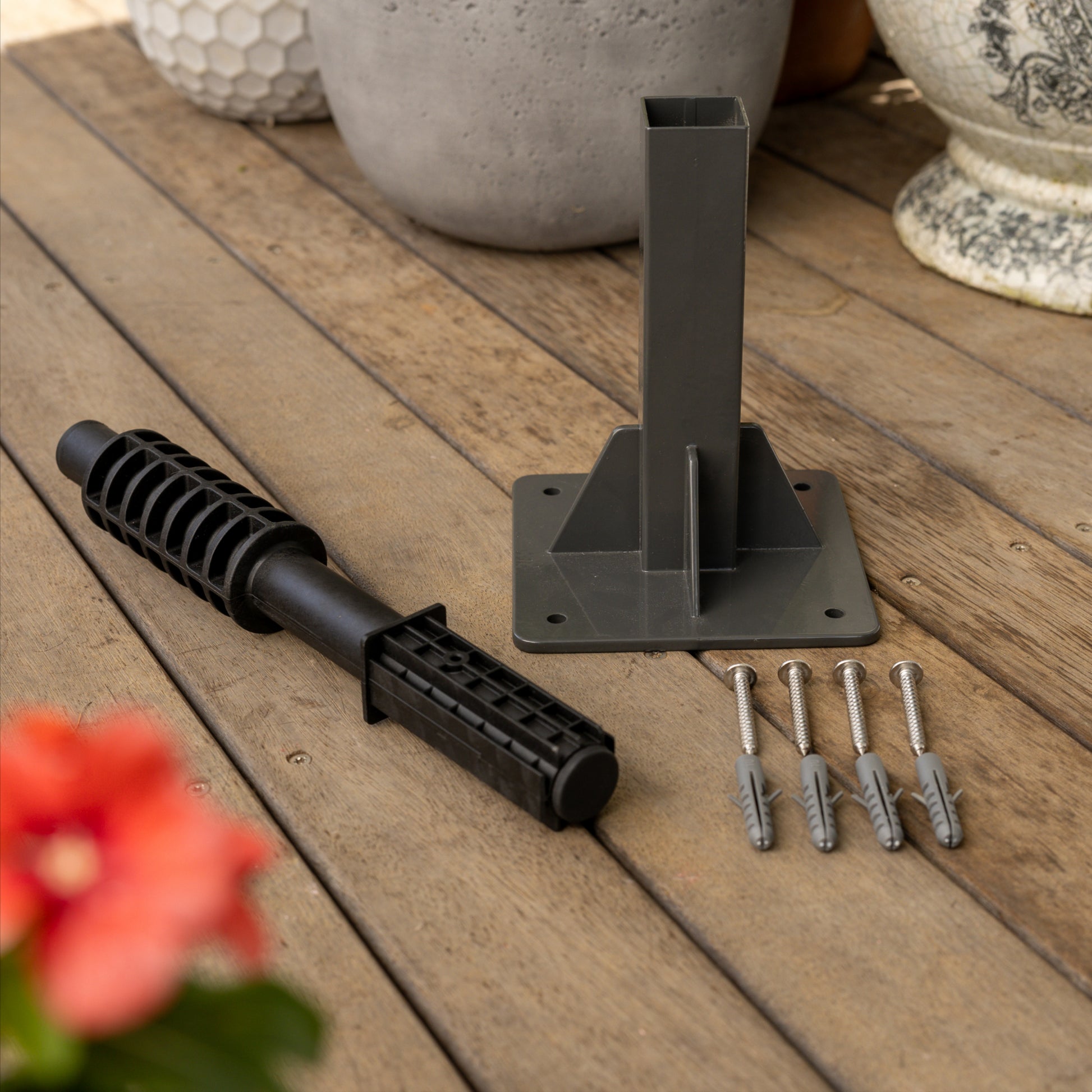 Ground Mount Evolve Series with included hardware on a wooden surface.