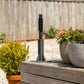 Ground Mount Evolve Series on a wooden deck with potted plants in the background