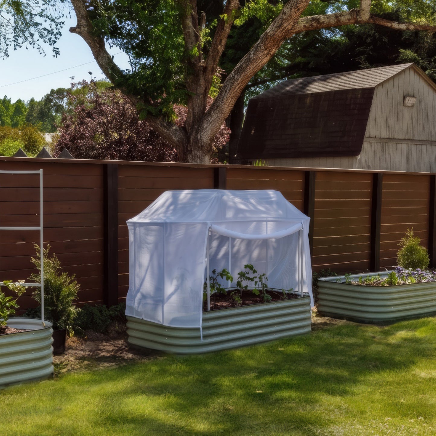 Garden bed with a white mesh cover in a backyard setting